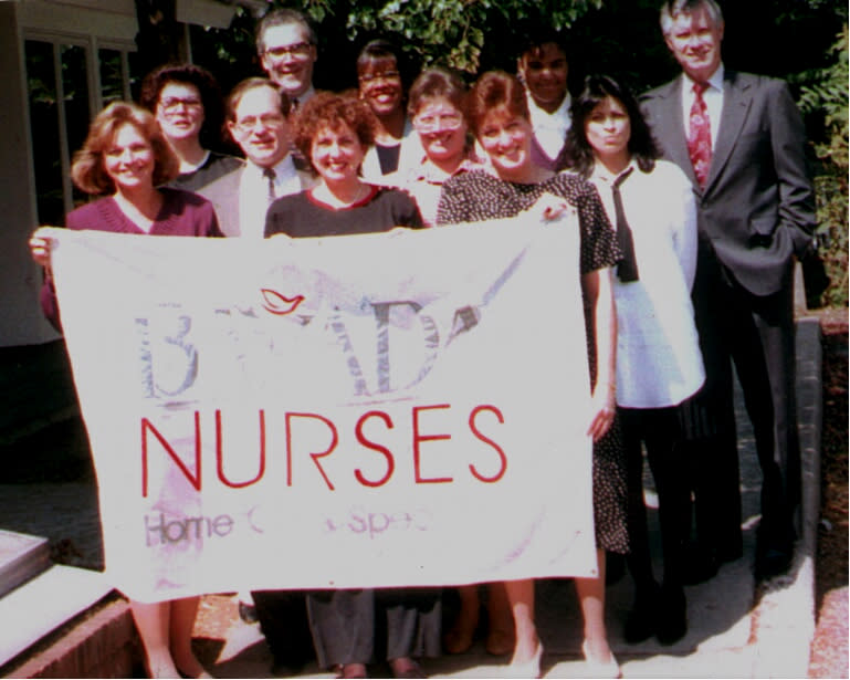 BAYADA Employees in 1995 holding BAYADA nurses sign