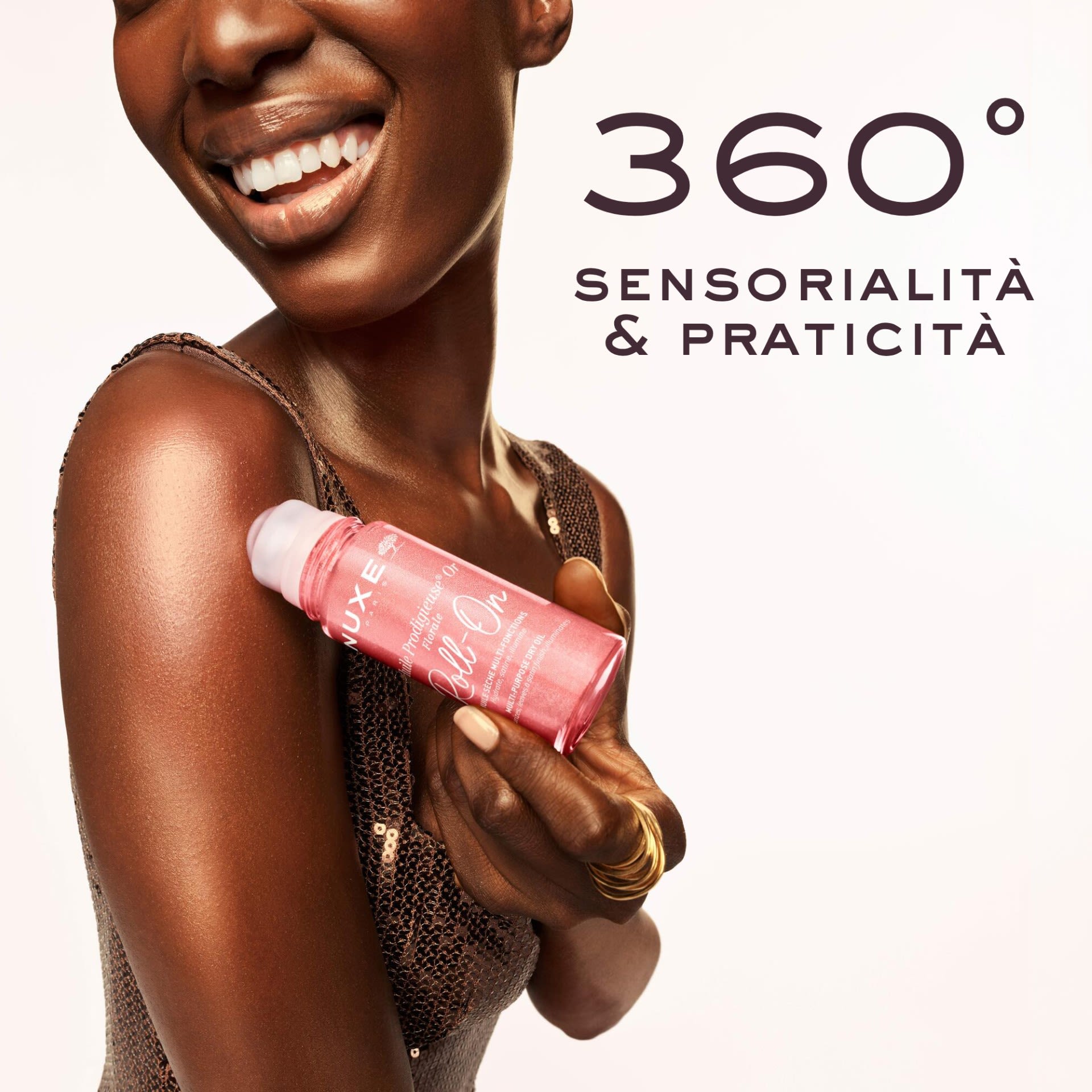 image - 951990718 - Olio secco multifunzione con microperle dorate in formato roll-on, nutre e illumina viso, corpo e capelli con una delicata fragranza floreale. Texture leggera per una pelle luminosa e sublimata. - 4865529_6.jpg