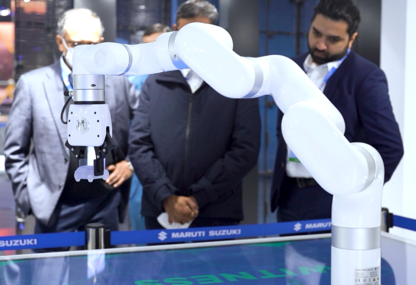 people standing in front of a robot