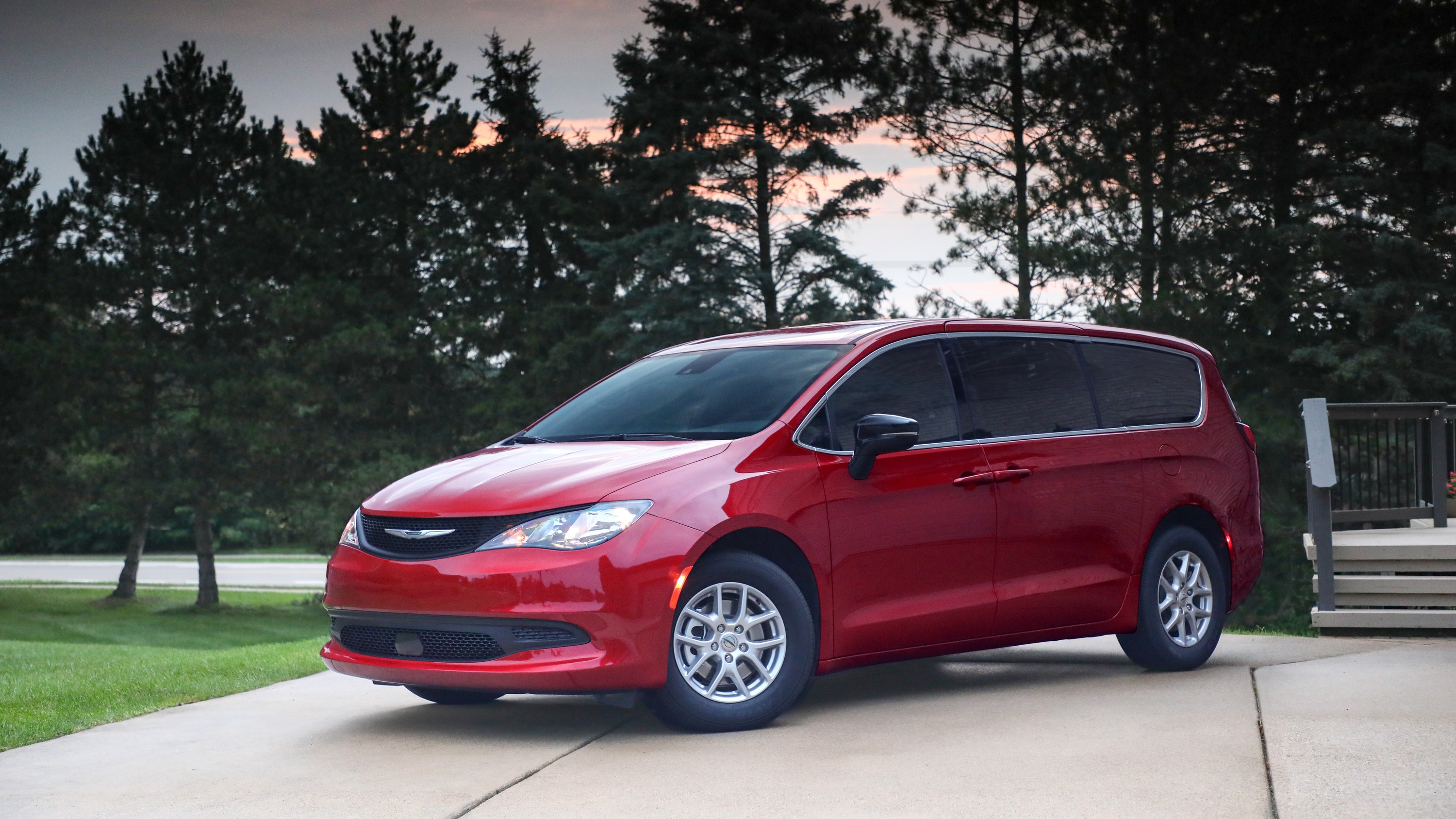 A sleek 2025 Chrysler Voyager minivan parked against a modern backdrop, showcasing its contemporary design and family-friendly appeal.