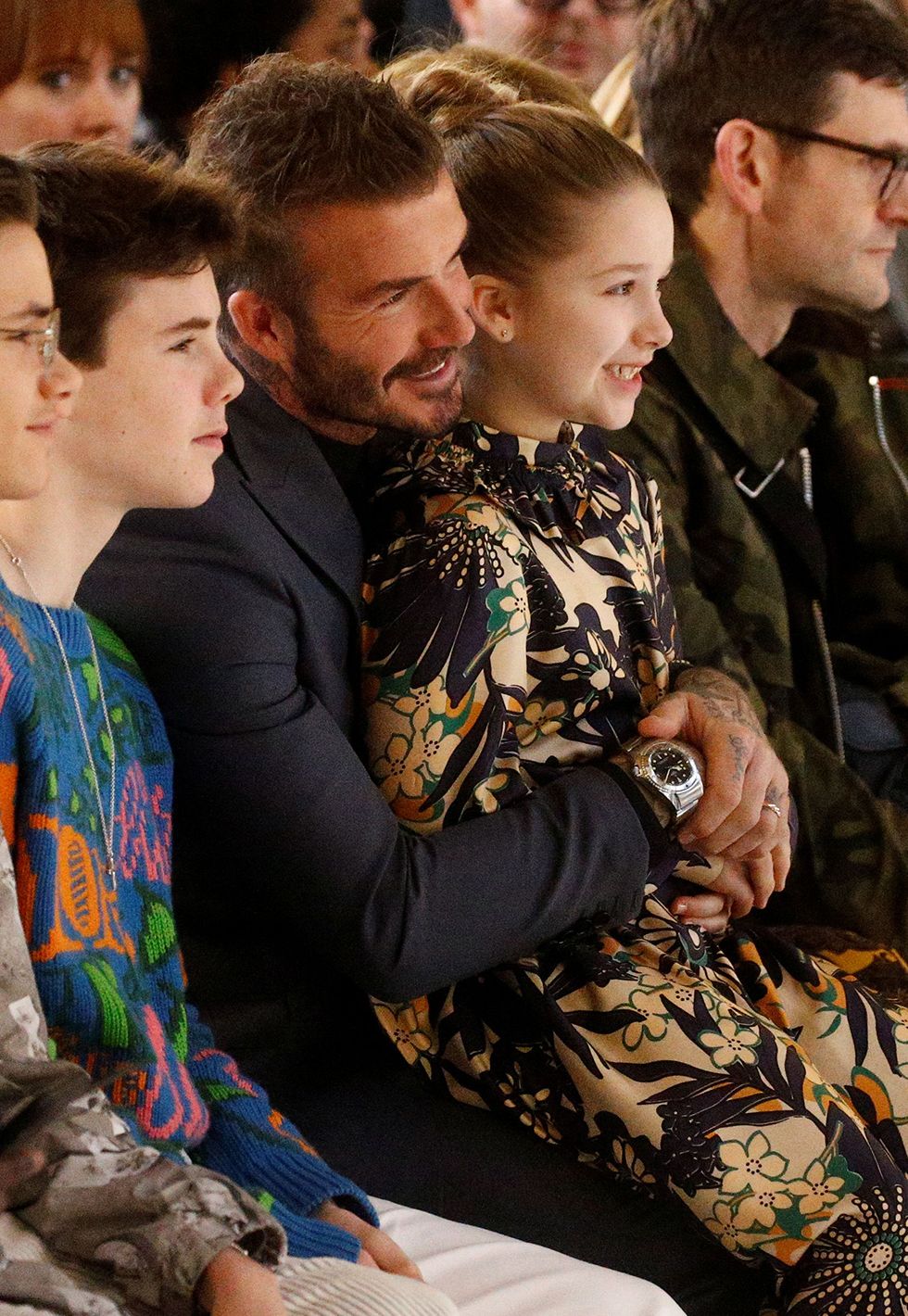 David Beckham papa poule au défilé de sa femme Victoria