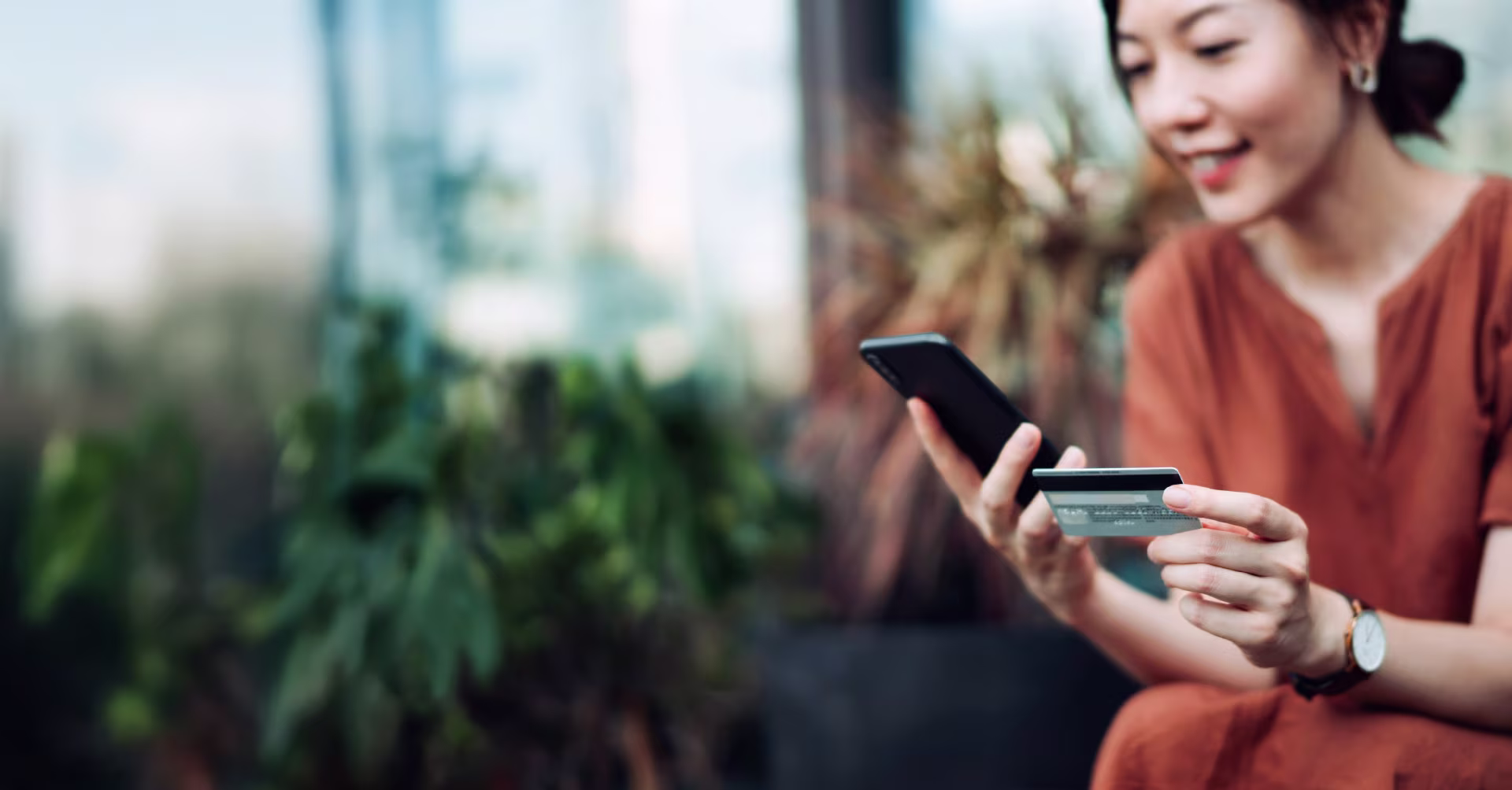 woman-with-phone-and-credit-card