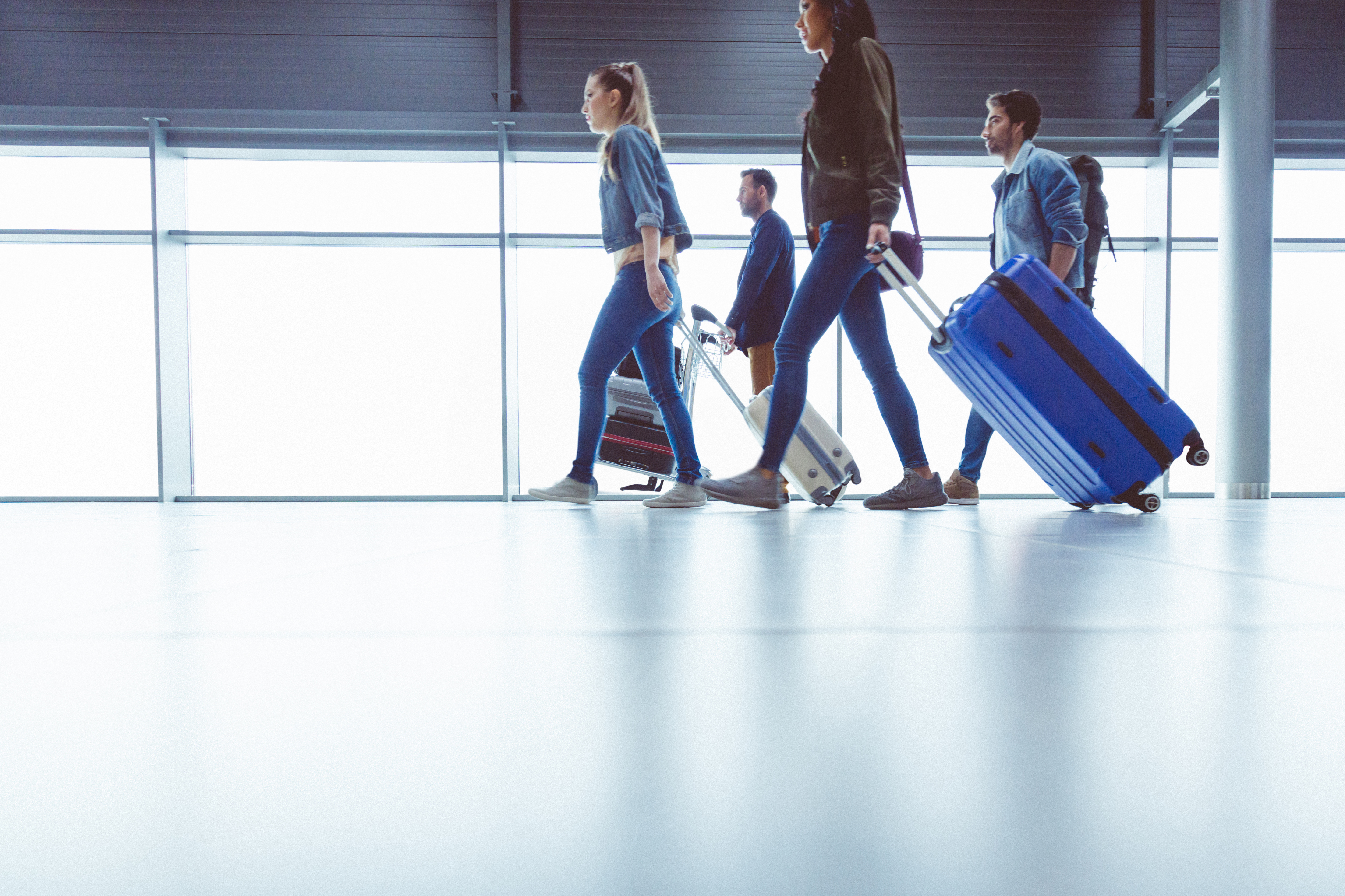 people-walking-with-suitcases