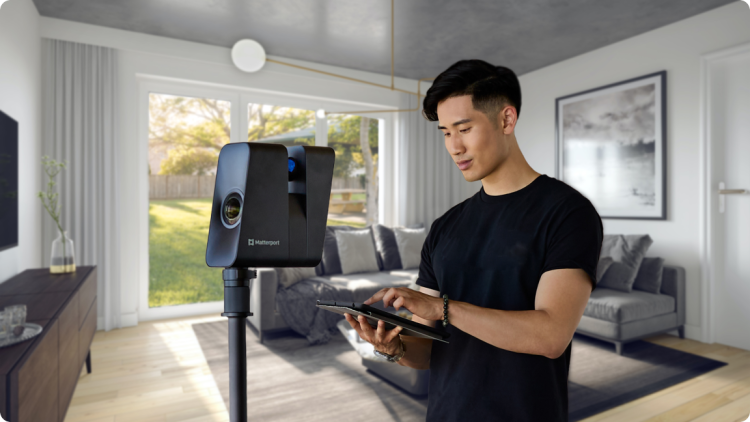 A man scanning a room with a Pro3 camera.