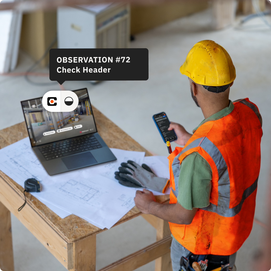 A construction worker using Procore within a Matterport model on a laptop