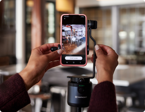 A Matterport Axis holding a phone