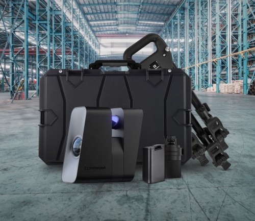 Pro3 camera, case, tripod and other accessories in a large empty warehouse