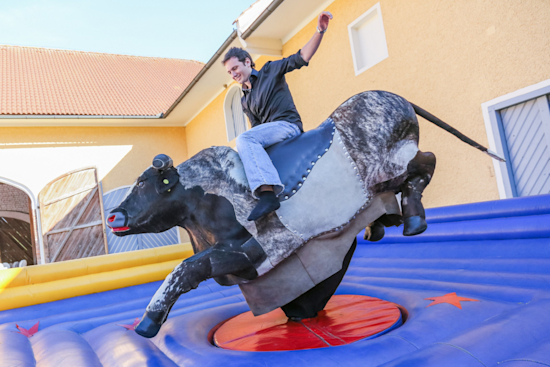 Riding the bull during during team building in Austria