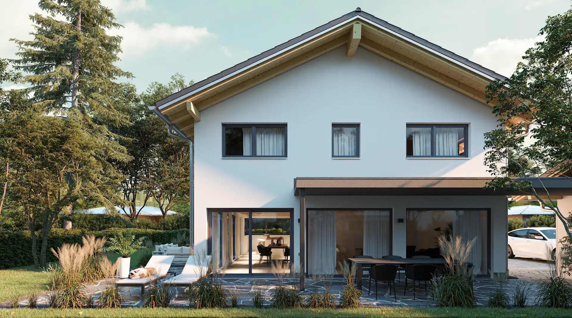 Modernes zweistöckiges Haus mit Terrasse, Gartenmöbeln und viel Grün im Garten.