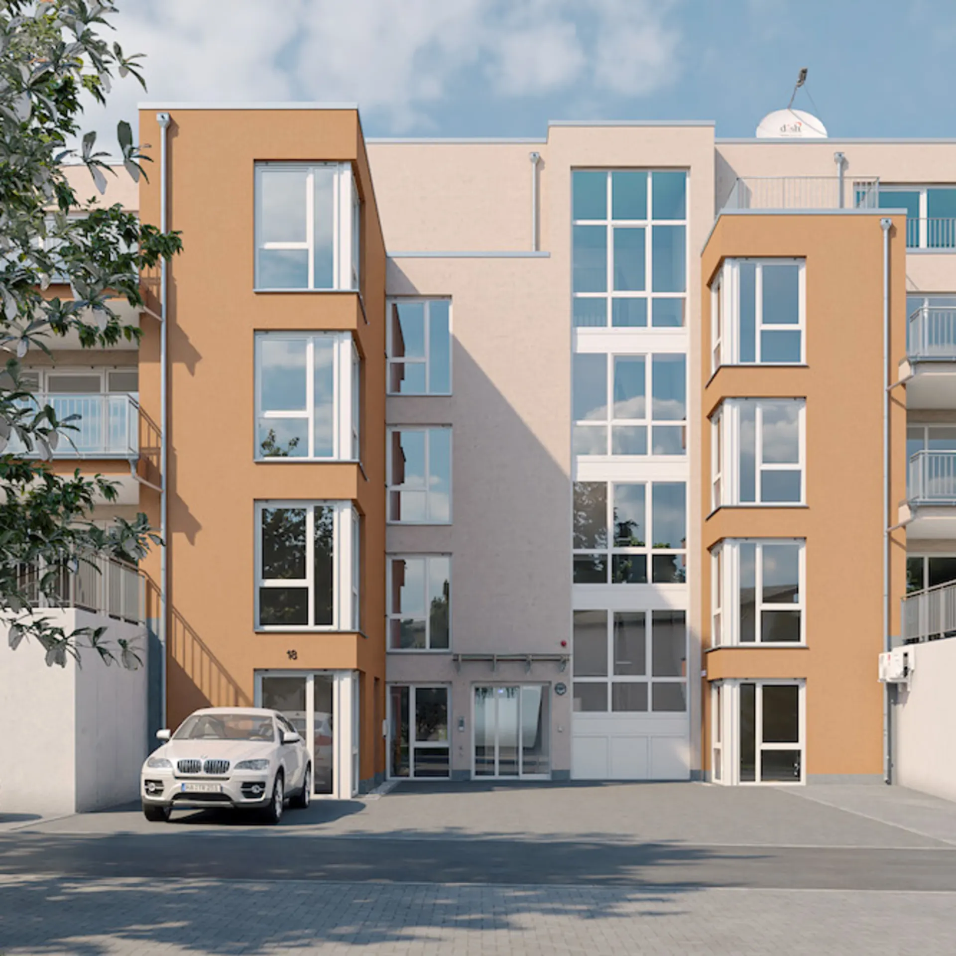 Moderne Wohnhausfassade mit großen Fenstern und geparkten Autos davor.
