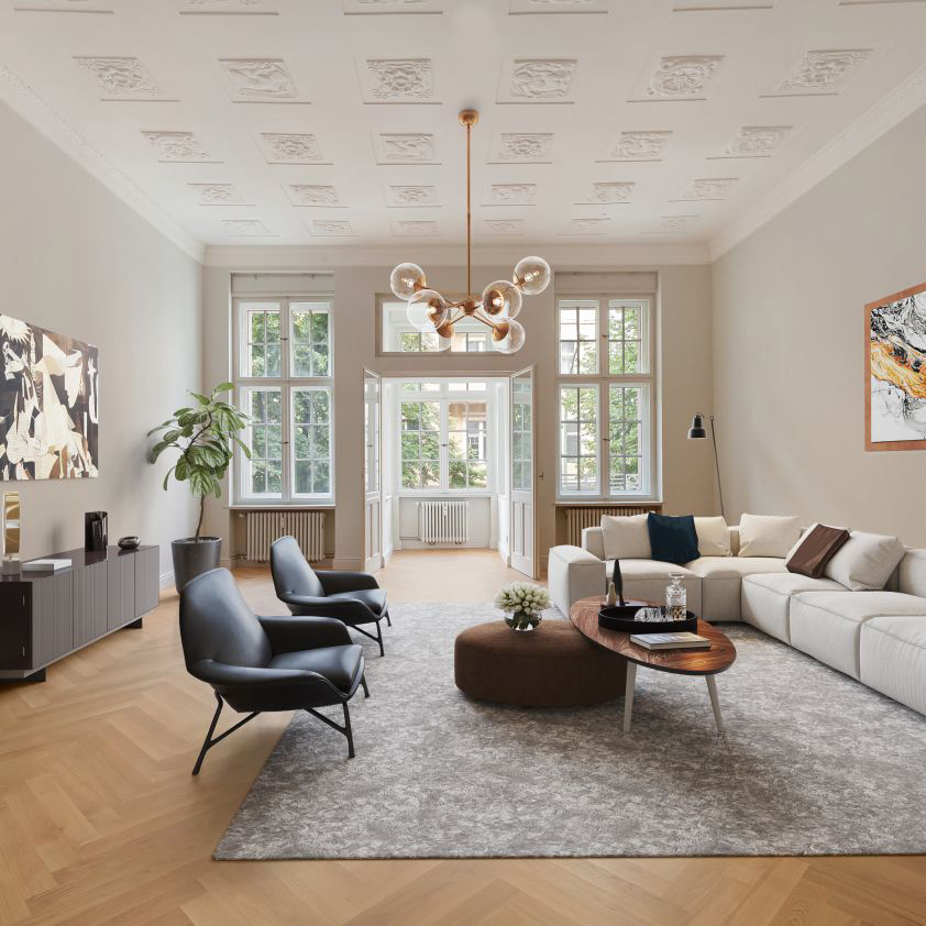 Helles Wohnzimmer mit großen Fenstern, Sofa, zwei Sesseln und modernem Kronleuchter.