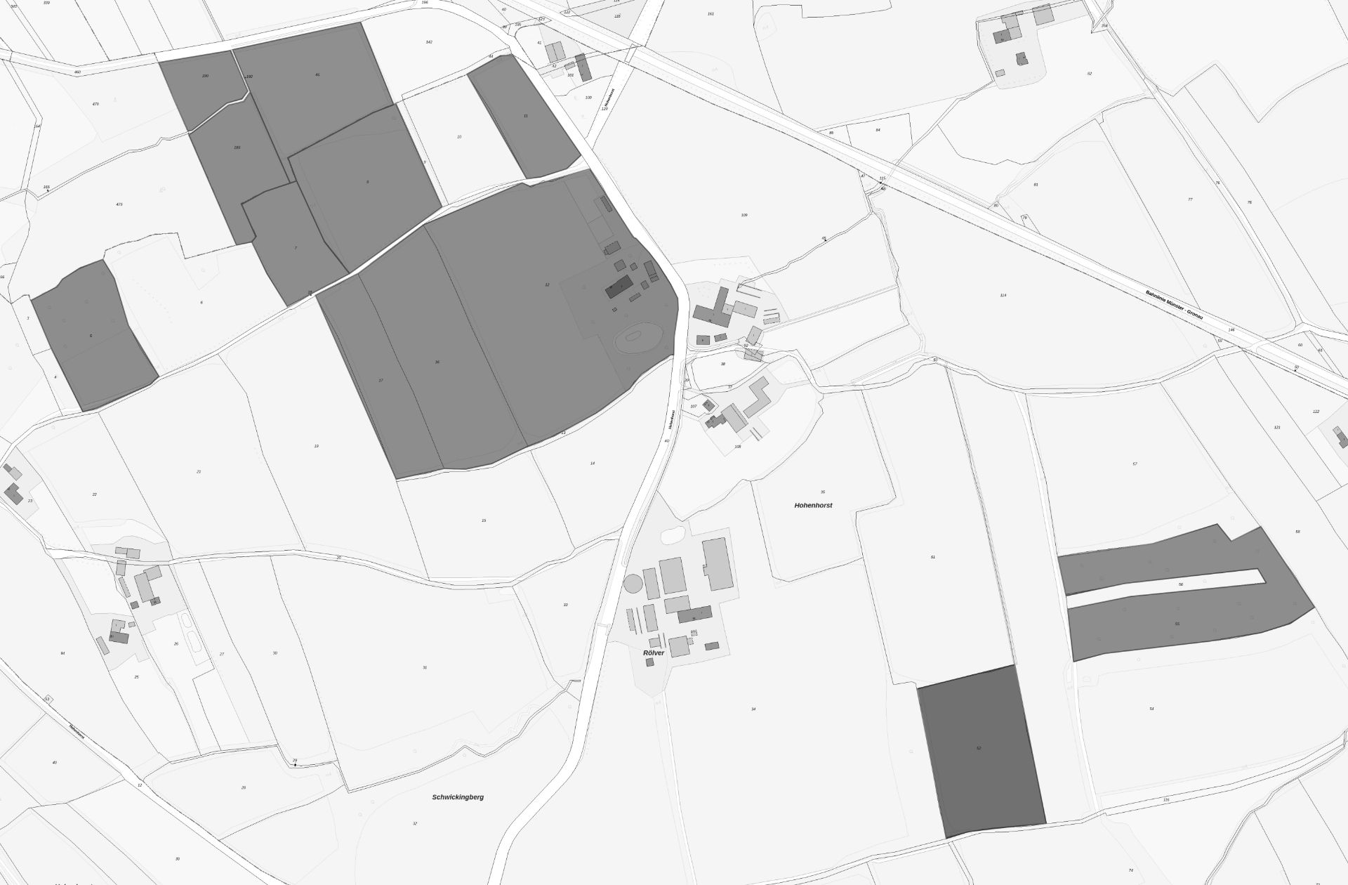 Schwarz-weiße Kartenansicht mit mehreren dunkel schattierten Flächen und eingezeichneten Straßen.