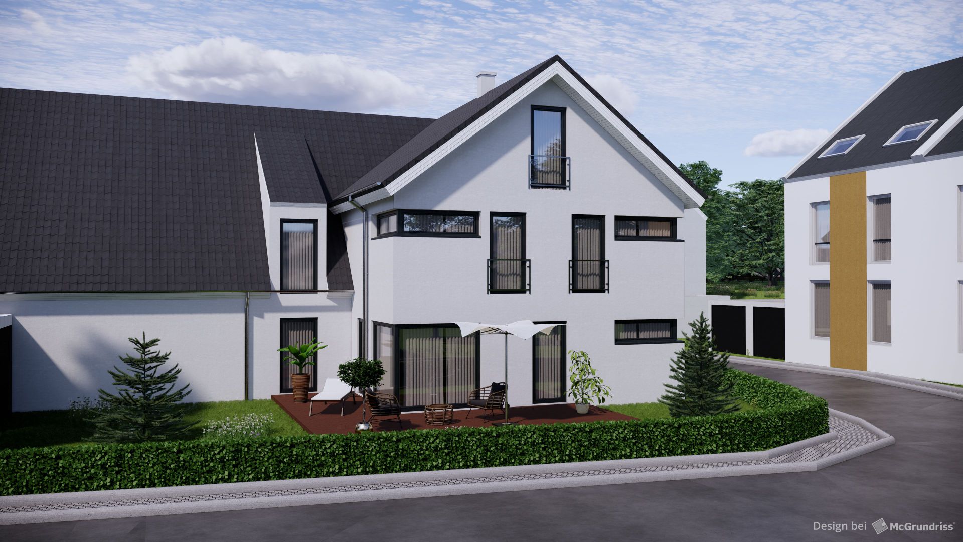 Modernes weißes Wohnhaus mit Terrasse, Gartenmöbeln und grüner Bepflanzung an einer Straße.