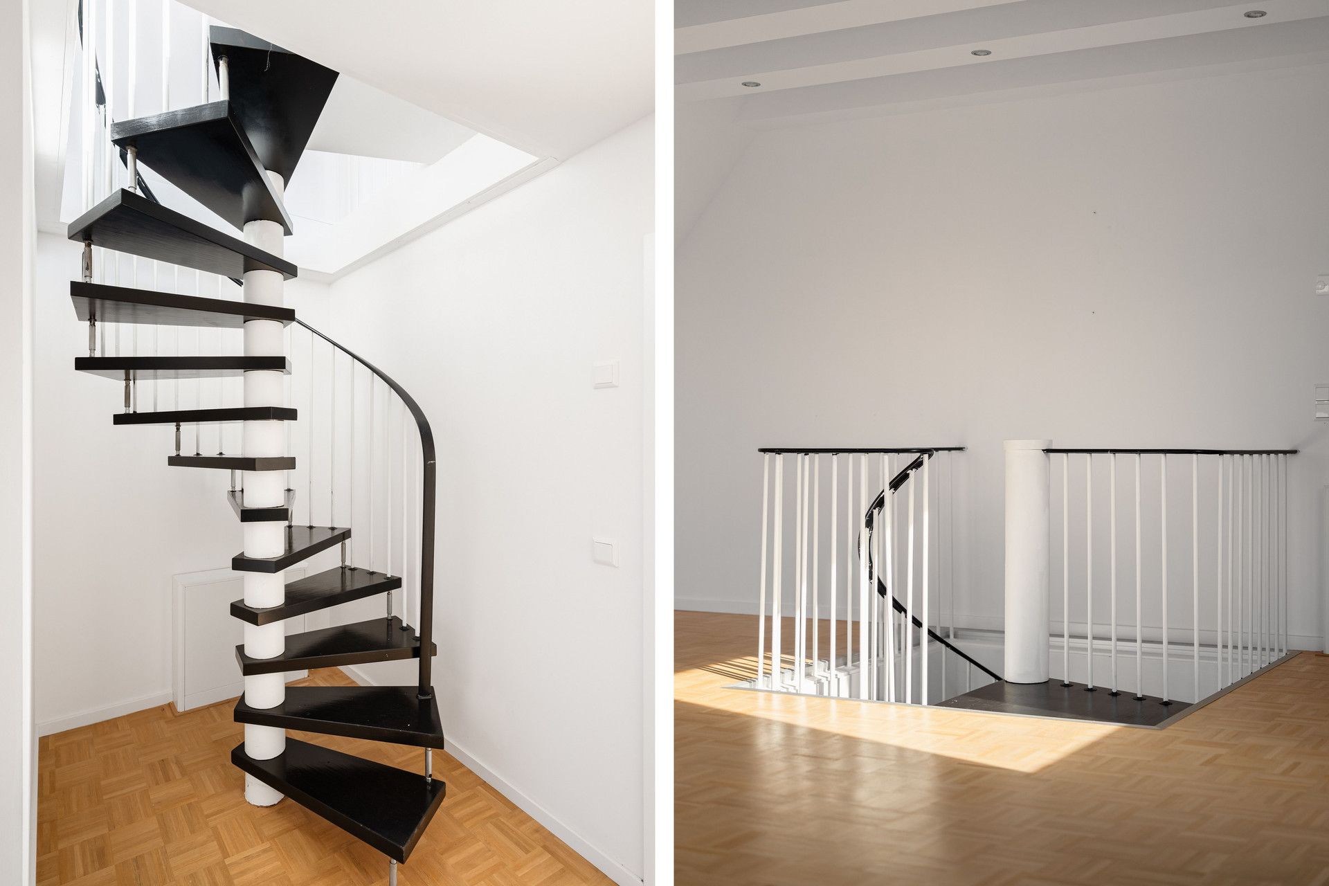 Schwarze Wendeltreppe mit weißen Streben in einem hellen Raum mit Parkettboden.