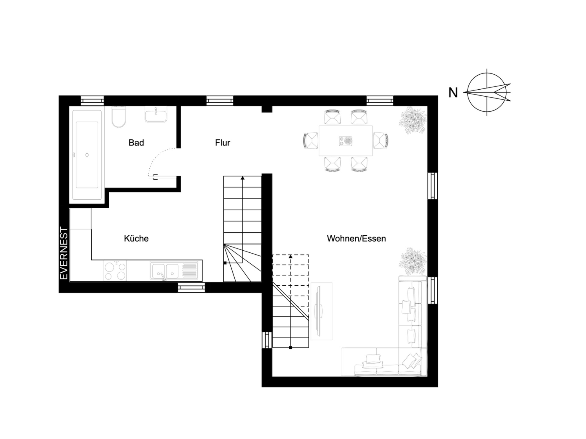 Grundriss eines Wohnbereichs mit Küche, Bad, Flur und Wohn-/Esszimmer.