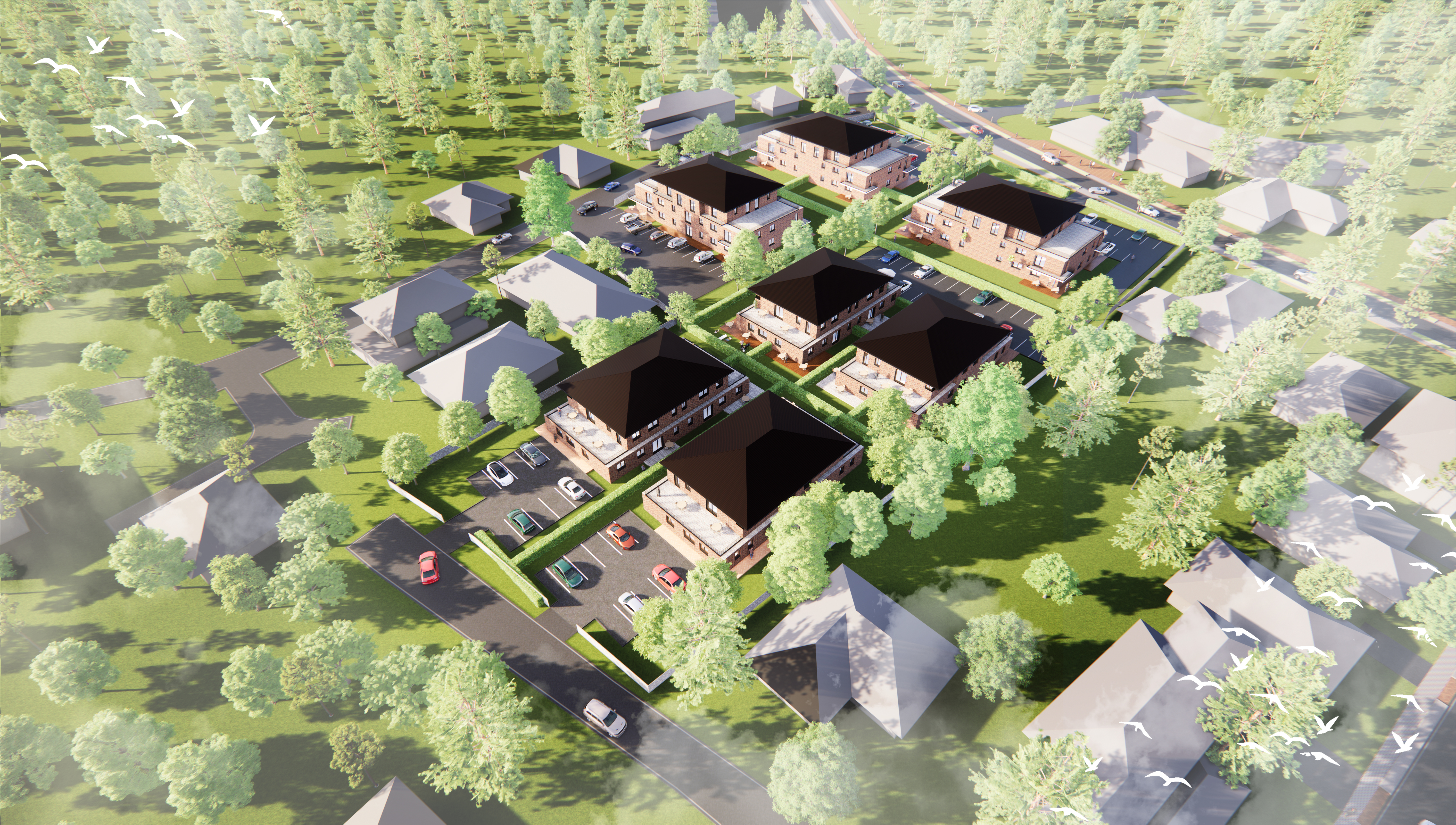 Luftbild von mehreren Wohnhäusern und Parkplätzen, umgeben von Bäumen und Straßen.