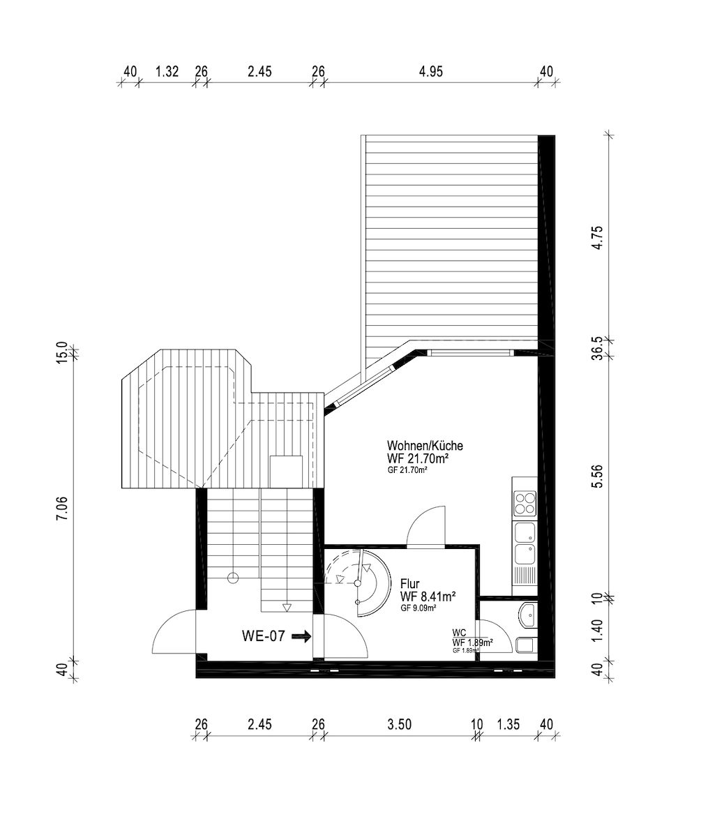 Grundriss einer Wohnung mit Wohnküche, Flur, WC und Treppenhaus.