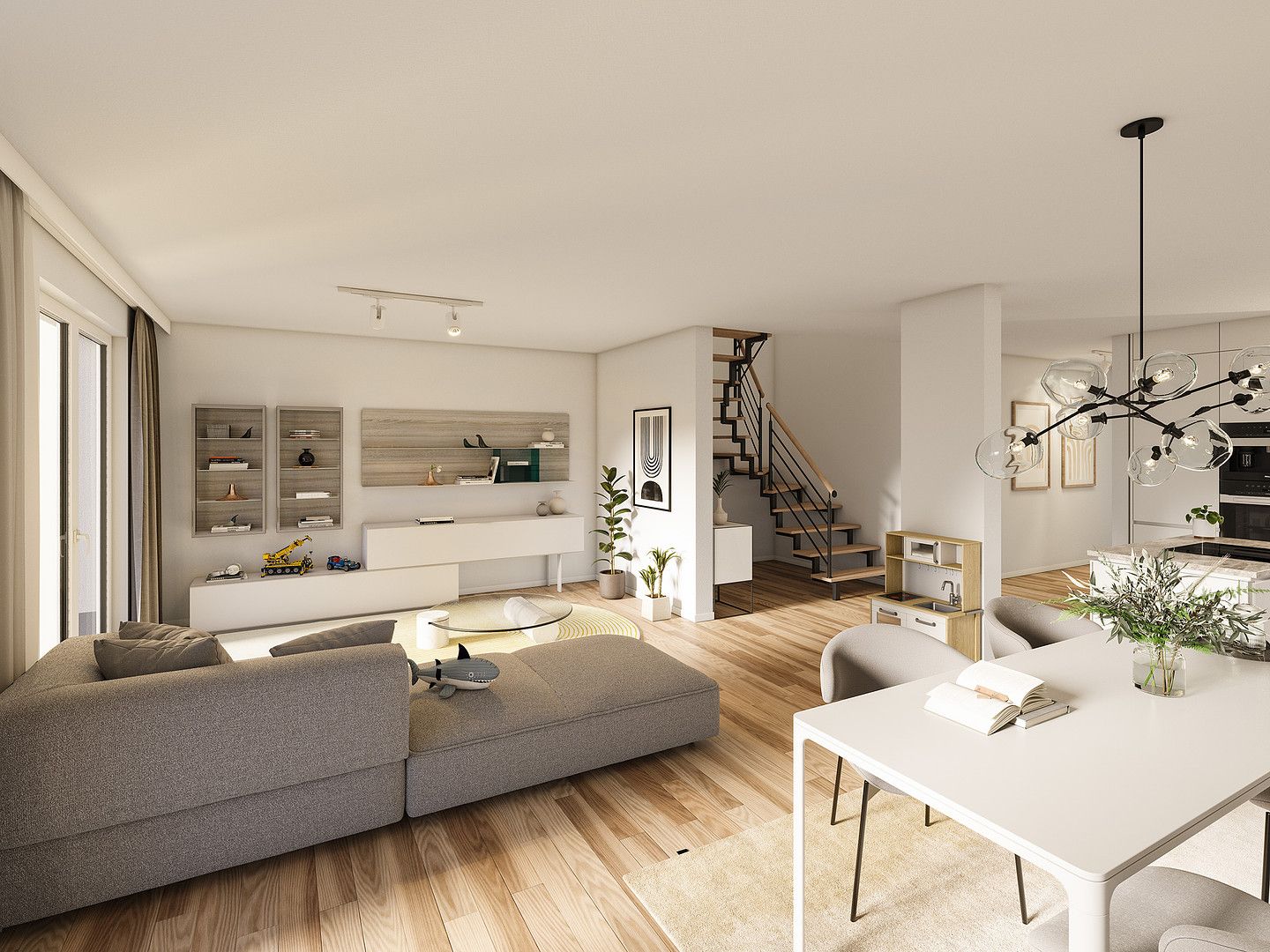 Modernes Wohnzimmer mit grauem Sofa, Esstisch, offener Küche und Holztreppe.