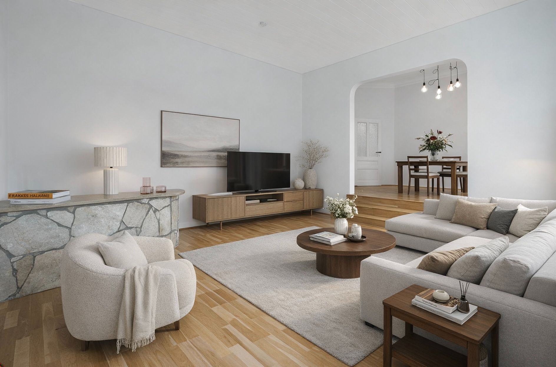 Modernes Wohnzimmer mit Sofa, Sessel, Couchtisch, Fernseher und Blick ins Esszimmer.