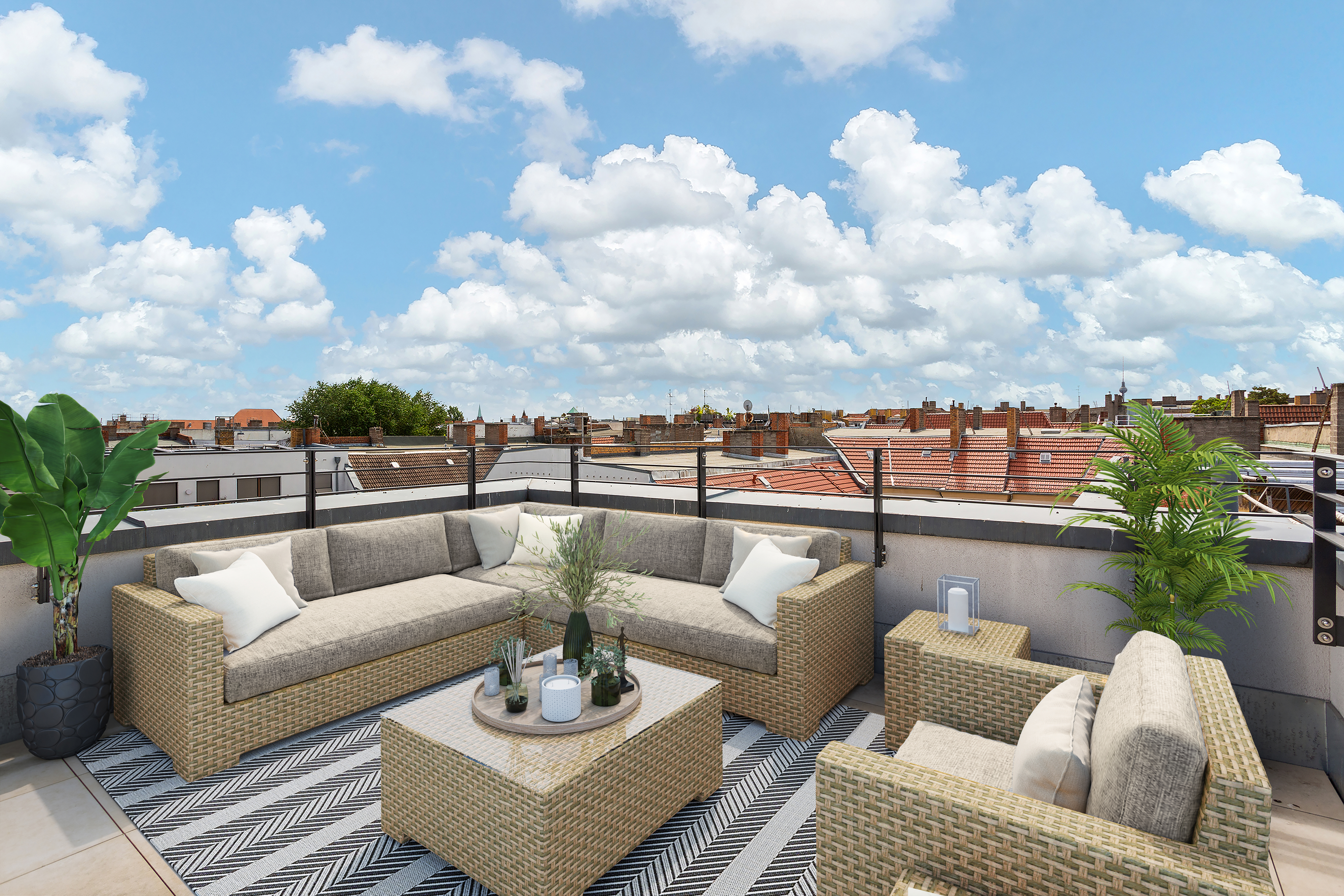 Moderne Dachterrasse mit Sitzgruppe, Teppich und Pflanzen, Ausblick auf Hausdächer.