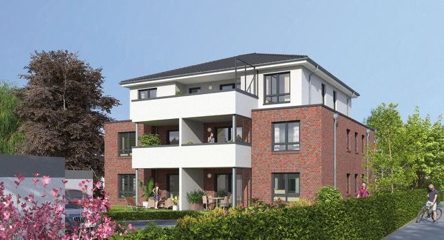 Dreistöckiges Wohnhaus mit Balkonen, roten Ziegelwänden und umliegendem Garten.
