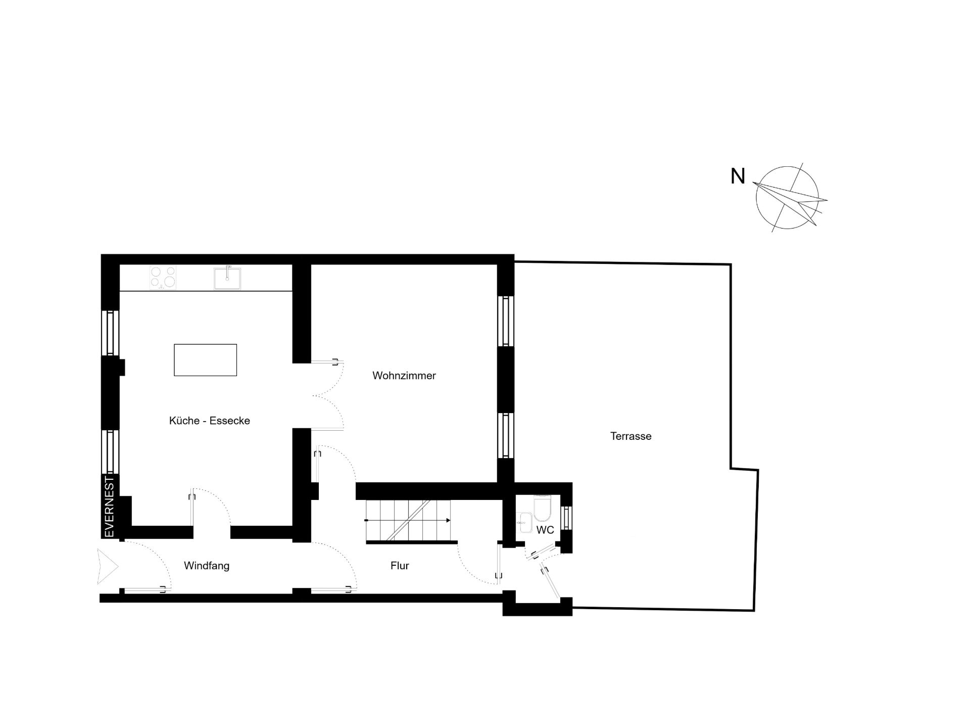 Grundriss mit Wohnzimmer, Küche-Ecke, Windfang, Flur, WC und Terrasse.