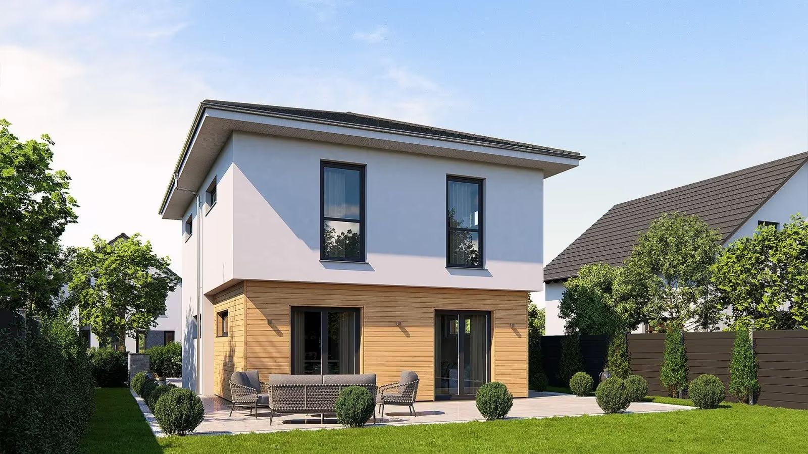Modernes zweistöckiges Wohnhaus mit Terrasse und Gartenmöbeln im grünen Garten.