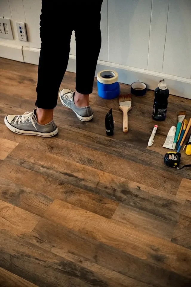 A man legs from Tajroofing and his set repairing a leaky roof