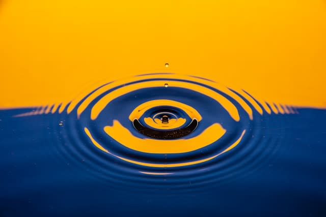 droplet of water hitting the water surface due to a leaking roof