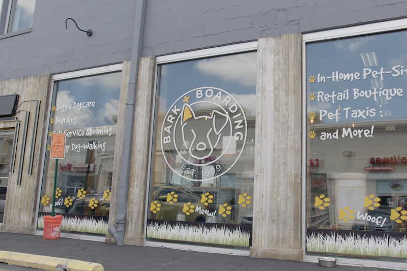 This is a picture of a storefront for a pet-related business. The ...