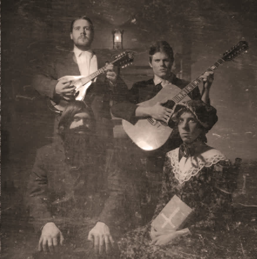 An old-timey sepia-tone photograph of a wholesome God-fearing family staring   creepily at the camera.