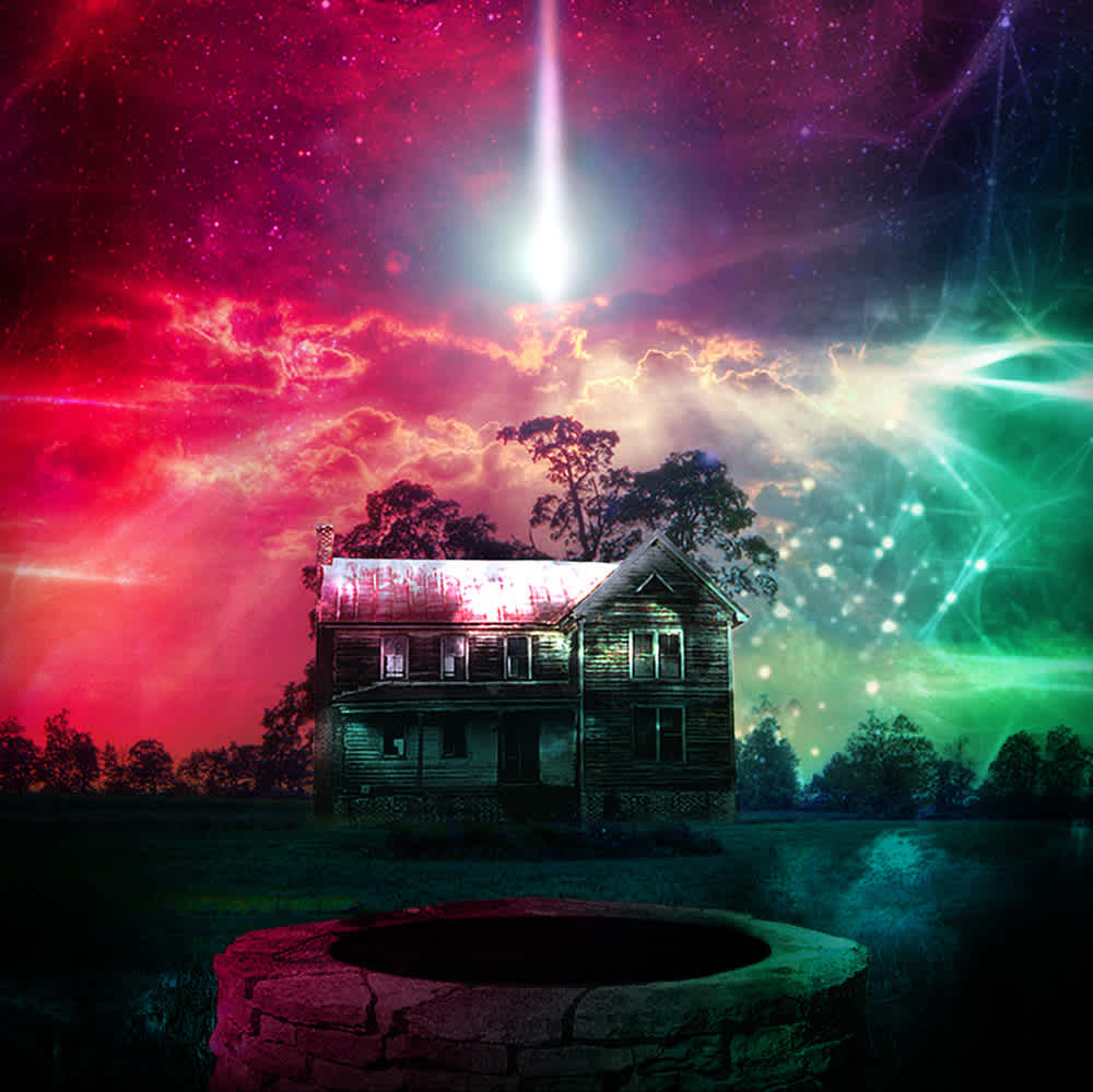 A large mansion surrounded by eerie multicolored light.