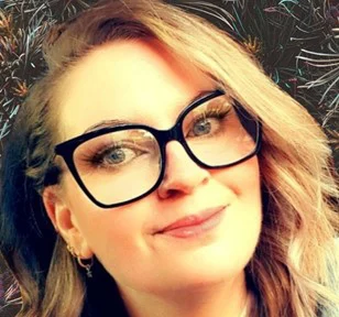 Profile photo of a lady wearing glasses.