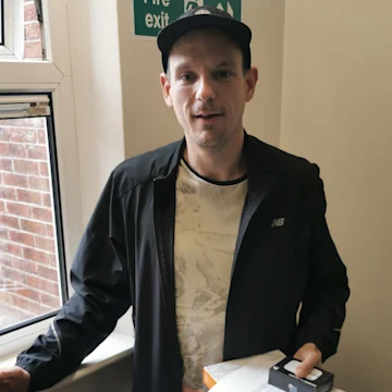 man-holding-mobile-hotspot-device