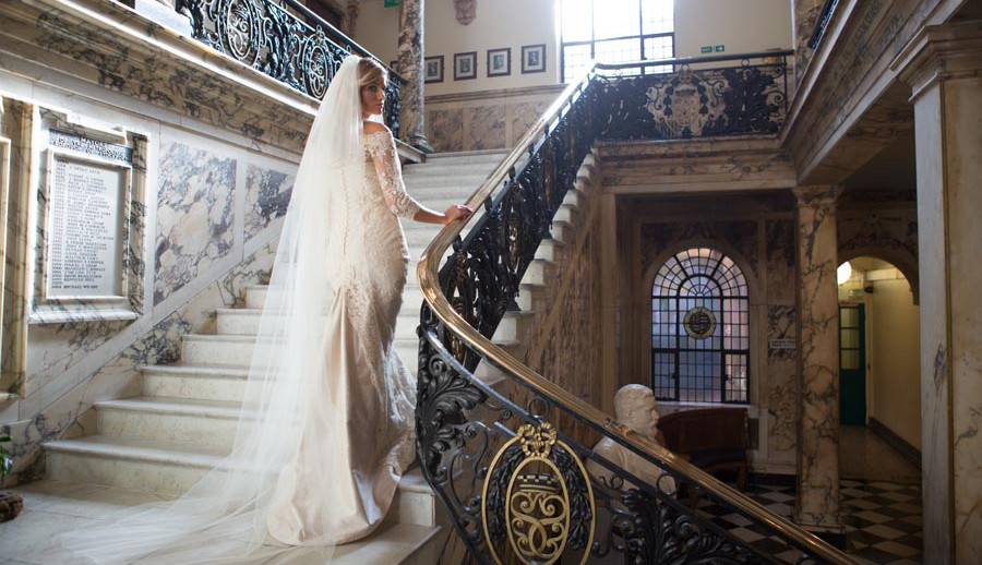 Weddings - Bride walking up our marble staircase