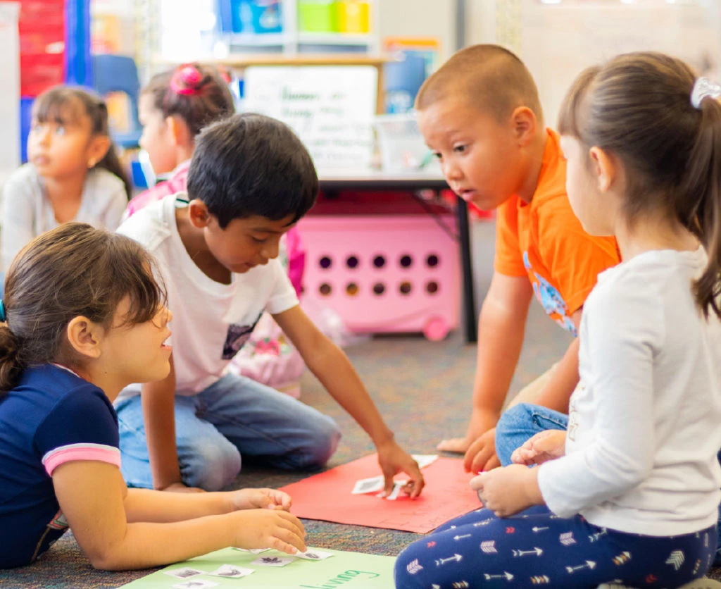 Young children engaged in a classroom setting.