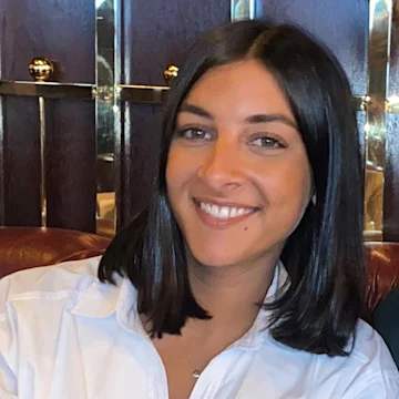 A lady smiling at the camera.