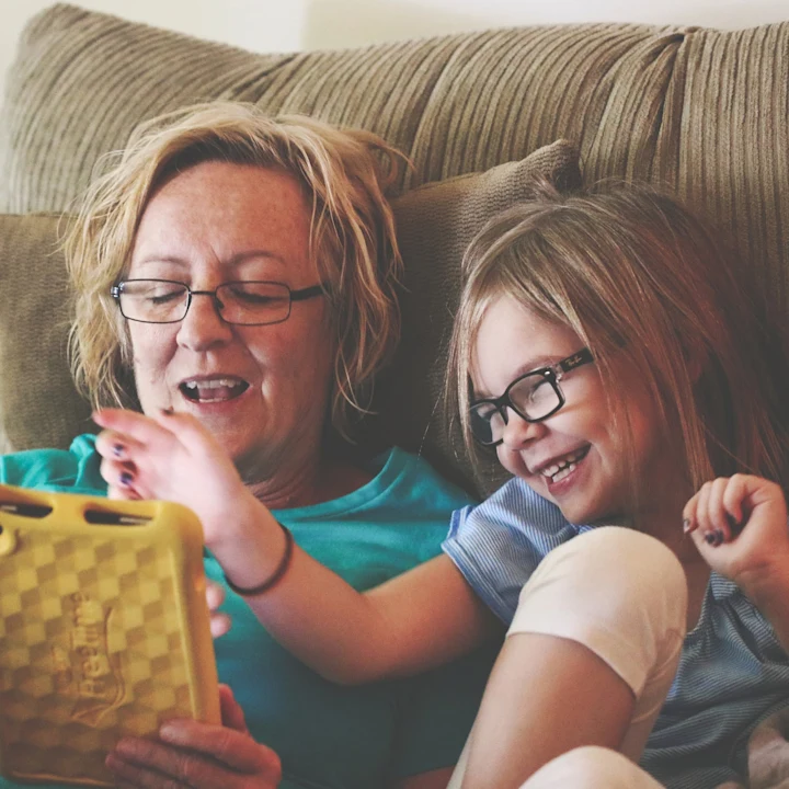 woman and child with tablet