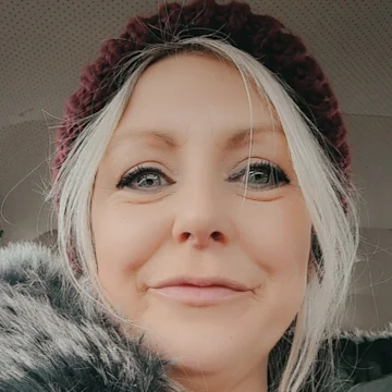 A lady smiling at the camera