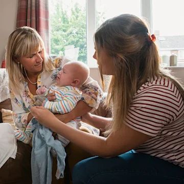 Foster carer with teenage mother and child
