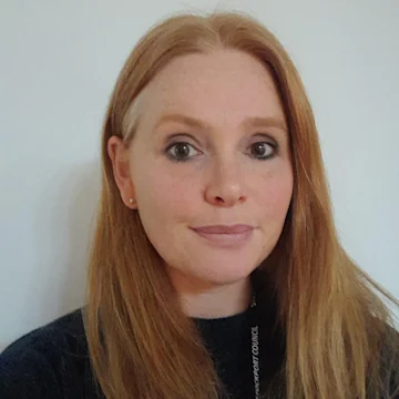 A woman smiling at the camera