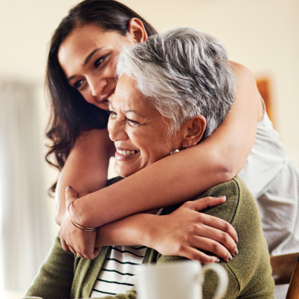 Daughter hugs mother