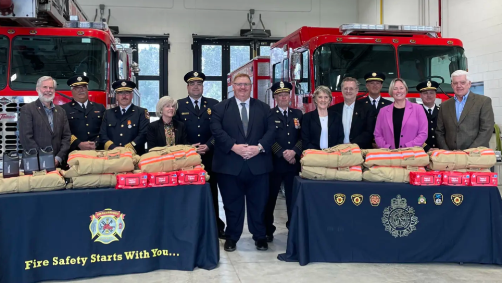 District of Muskoka fire department posing with safety equipment afforded to them by the Province of Ontario's Fire Protection Grant