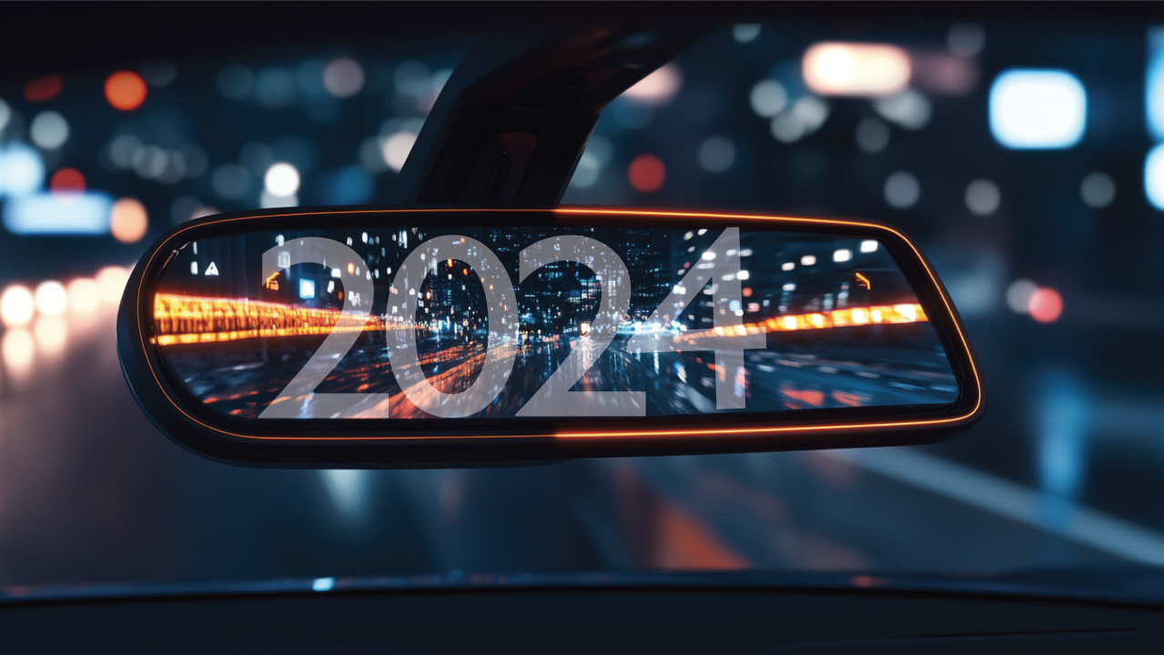 A car's rearview mirror with 2024 written within