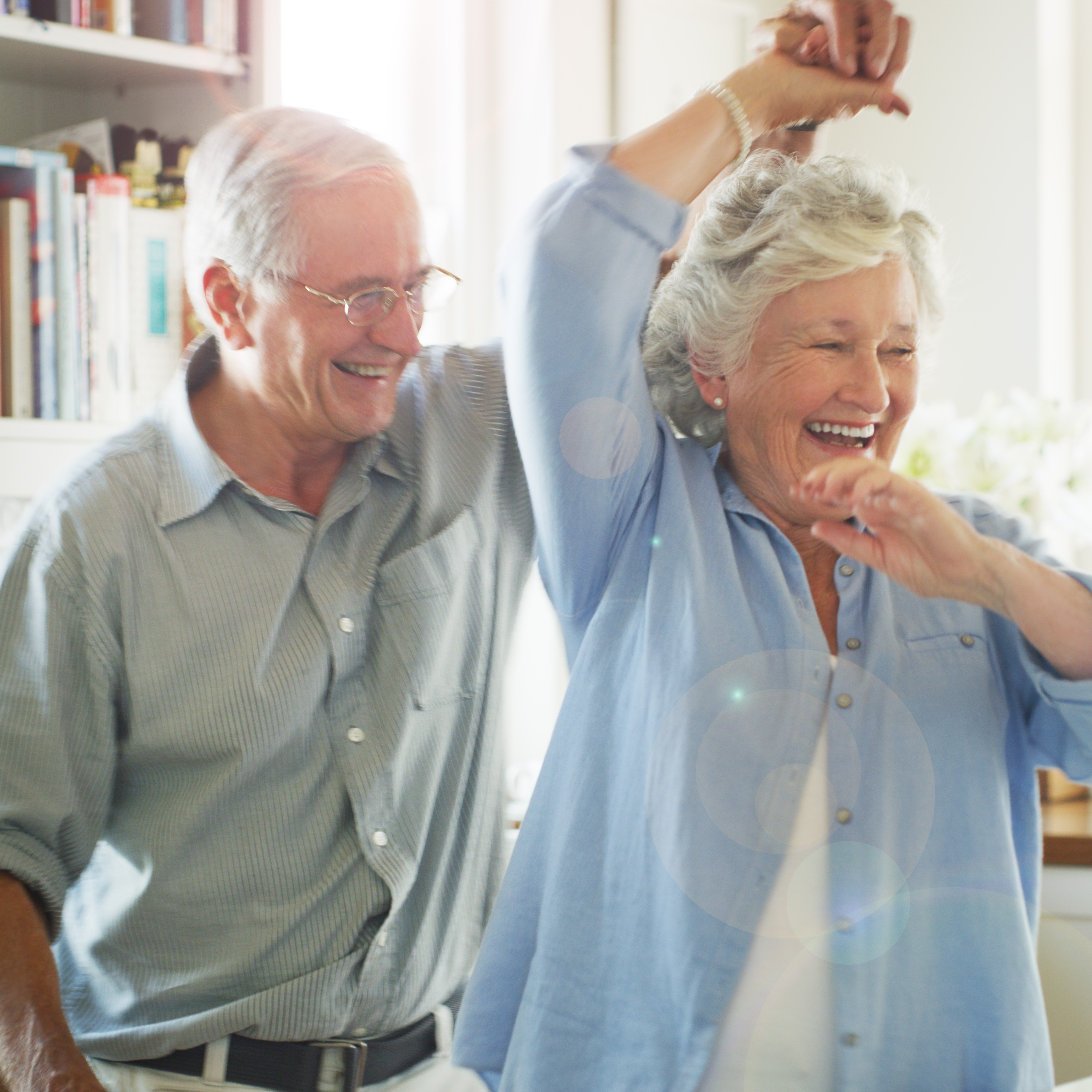 A man and a woman smiling while dancing