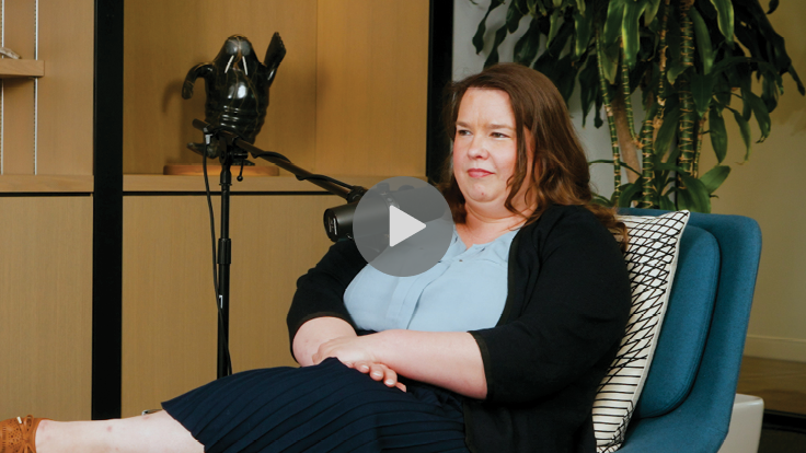 Woman sitting at microphone