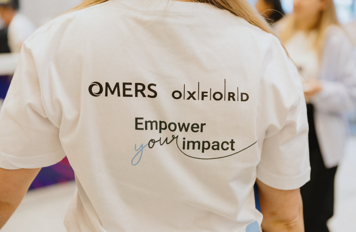 The back of a t-shirt that has the OMERS and Oxford logo and says 'Empower your impact'