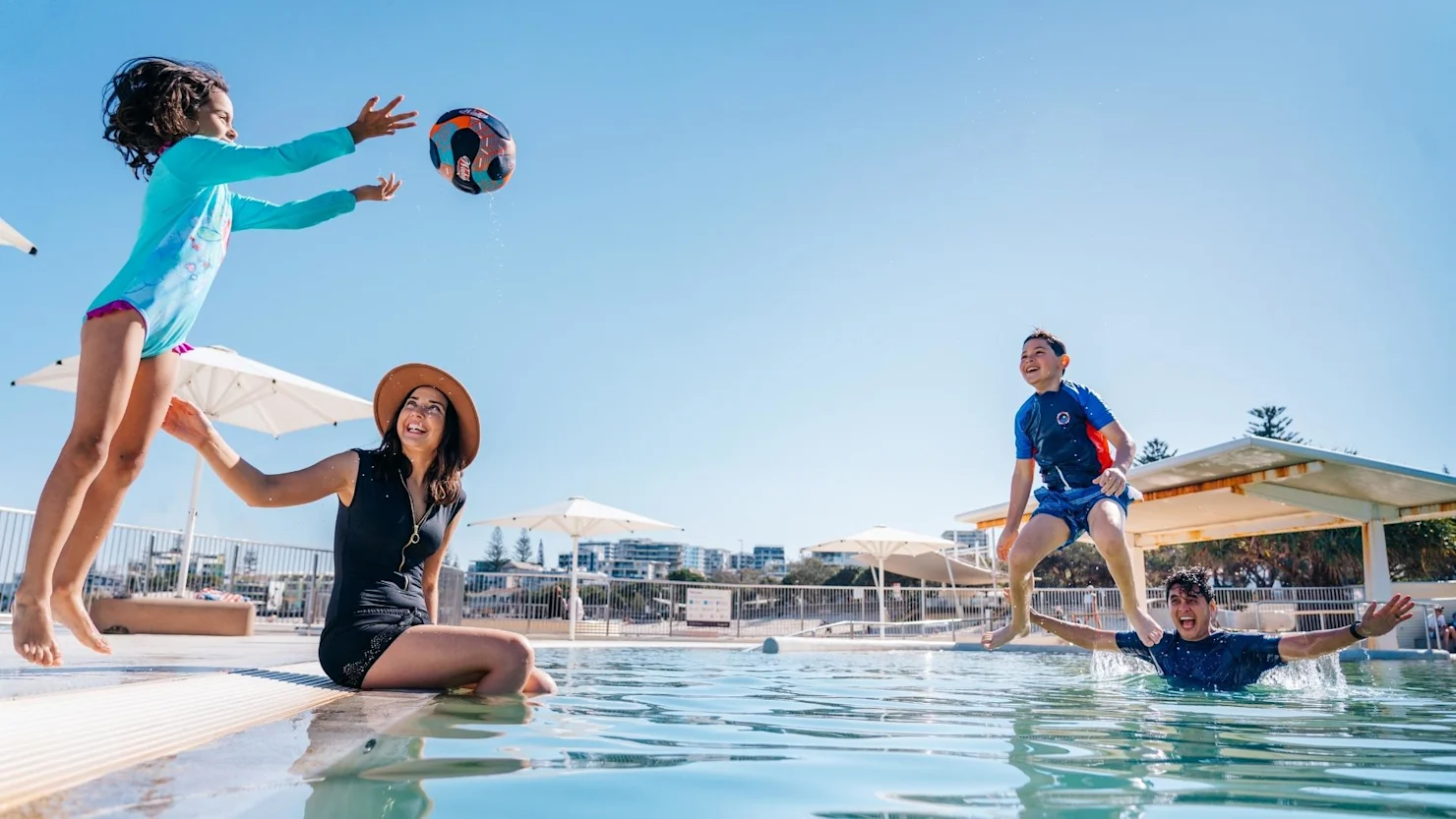 Family playing at Kings Beach Ocean Pool, Caloundra, Sunshine Coast