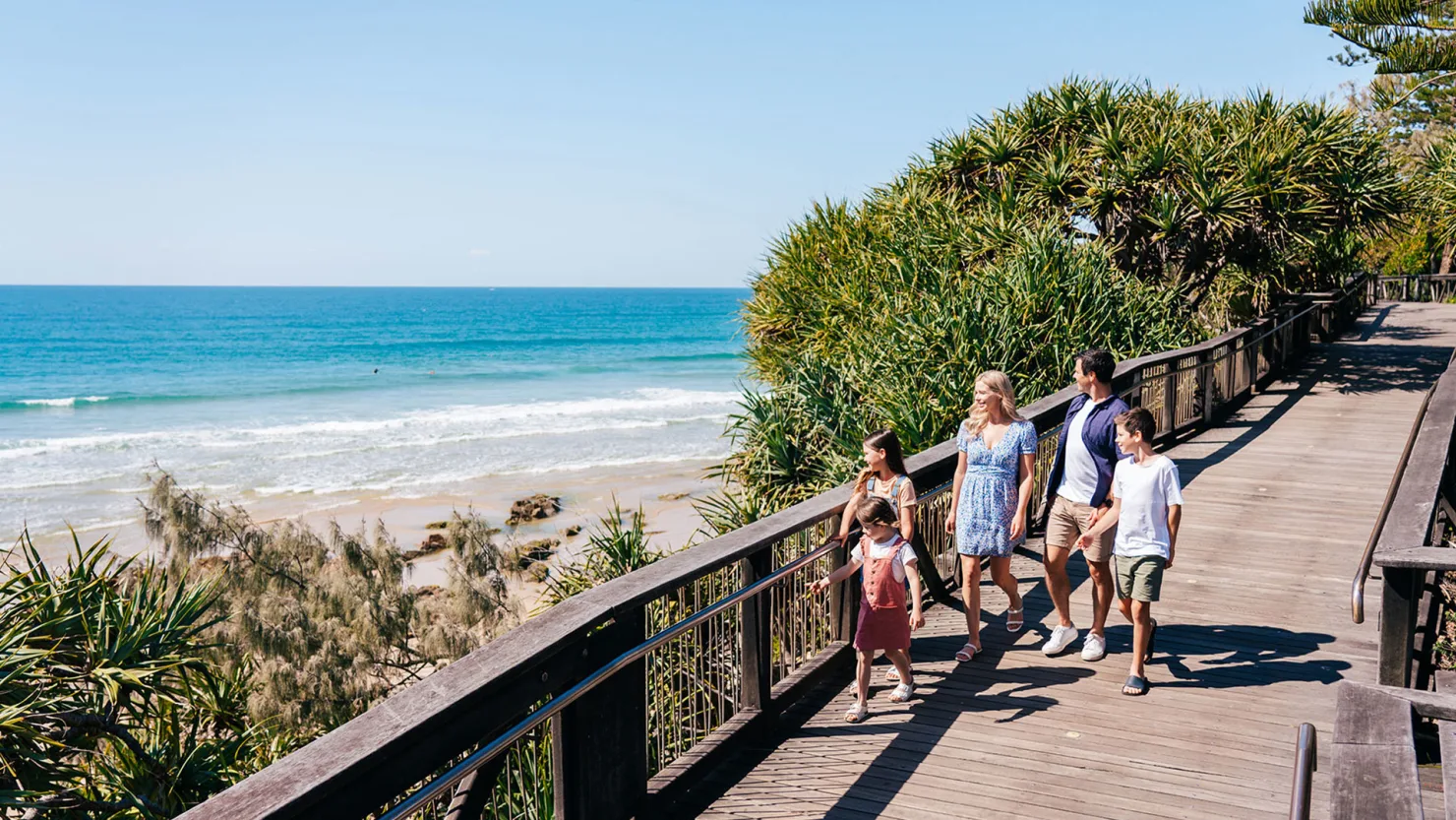 Family on boardwalk at Coolum Beach