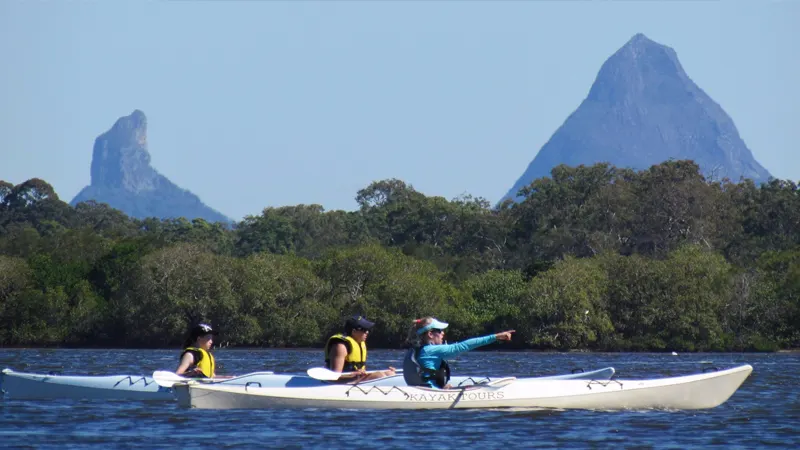 The Glass House Mountains know how to photo bomb a kayak tour. 